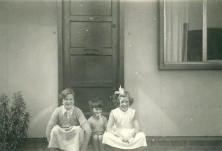 Mel, Peter and Hilary Ball  on the step of their prefab, 48 Abbots Gardens, Shrewsbury | Peter Ford