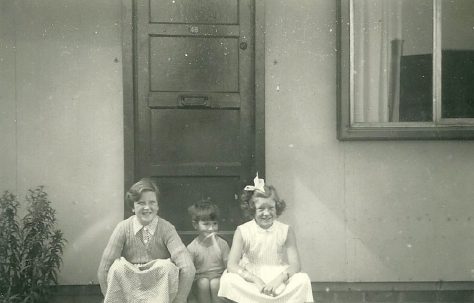 Mel, Peter and Hilary Ball  on the step of their prefab, 48 Abbots Gardens, Shrewsbury