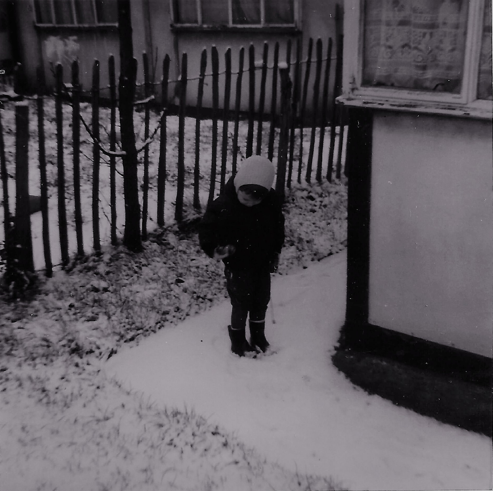 Paul outside the prefab in the snow. Berthon Street, Deptford, London SE8