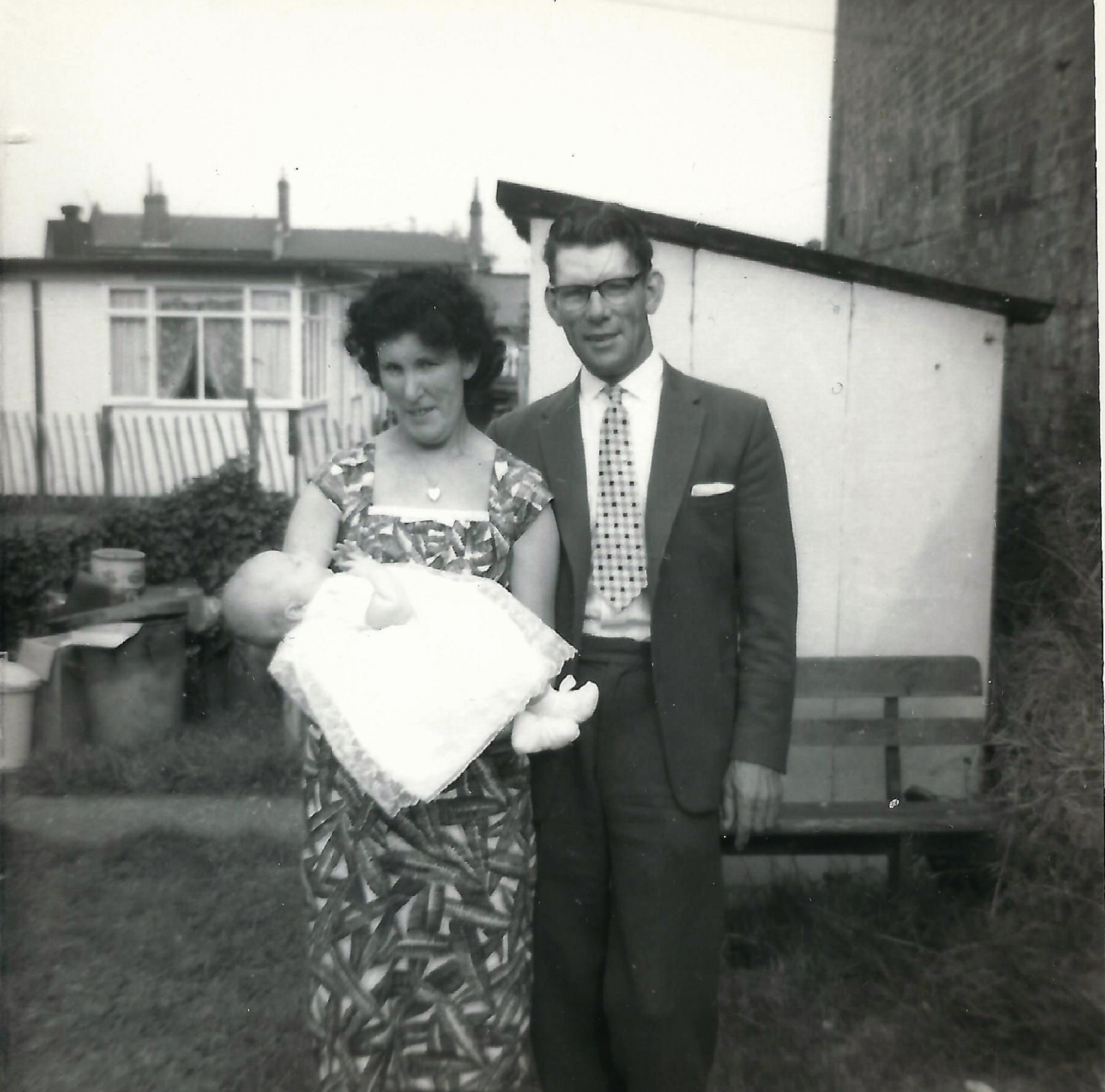 Kit and Charlie Phelps (Paul's paternal grandmother and her second husband) holding their first grandchild (Gary Maslin - Paul's cousin). Berthon Street, Deptford, London SE8