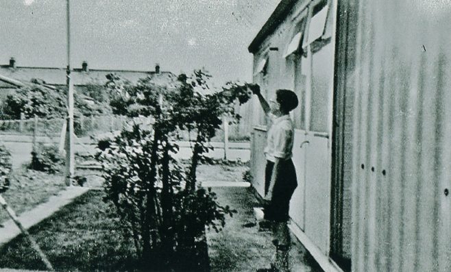 Outside the prefab at 1 Woodman Road, Hainault Estate