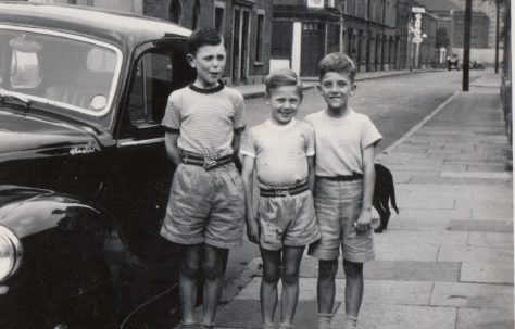 Harry, me and friend John, he lived in the victorian house next to the house with the patched wall....It's 1956 and we are ready for a day out to the hopfields then on to the seaside. Tooke Street, London E14