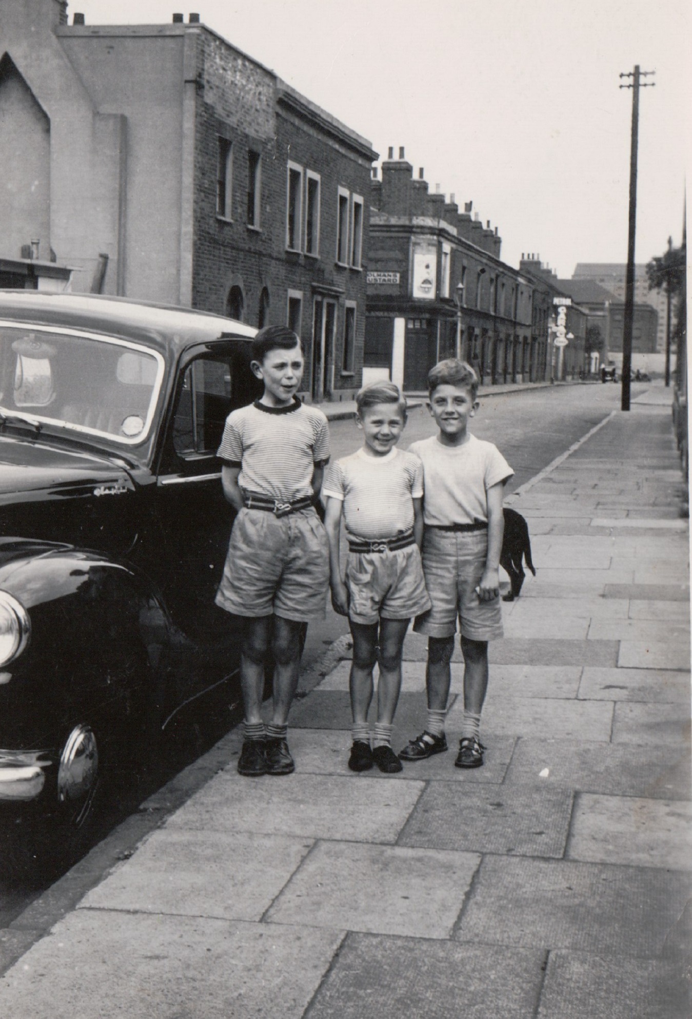 Harry, me and friend John, he lived in the victorian house next to the house with the patched wall....It's 1956 and we are ready for a day out to the hopfields then on to the seaside. Tooke Street, London E14