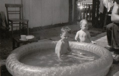 My younger brothers enjoying the pool,looked on by my uncle Dennis. Tooke Street, London E14
