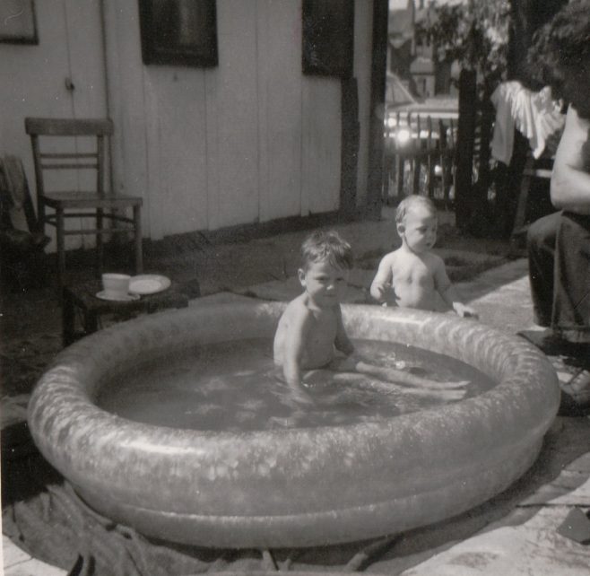 My younger brothers enjoying the pool,looked on by my uncle Dennis. Tooke Street, London E14