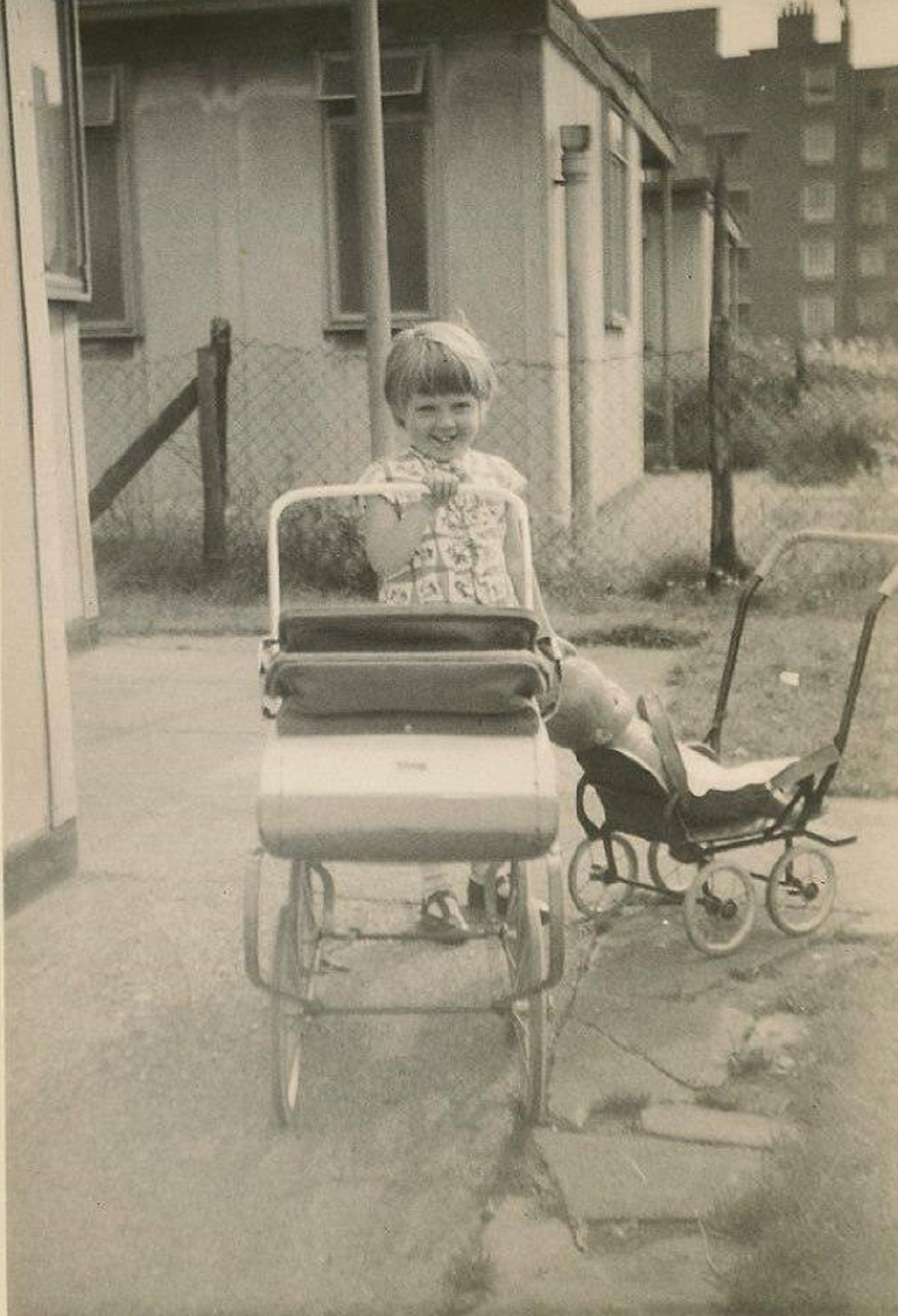 With two prams outside the prefab, Homerton, London E9