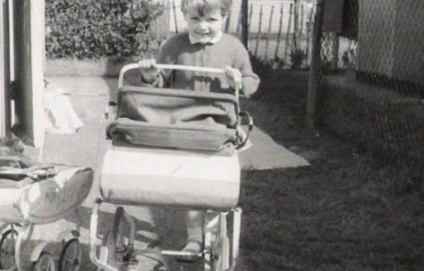 With her pram outside the prefab, No.5 Holmbrook street, off of Brooksbys Walk, London E9