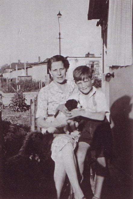 Jim and his mum, and dog. Excalibur Estate, London SE6