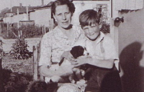 Jim and his mum, and dog. Excalibur Estate, London SE6