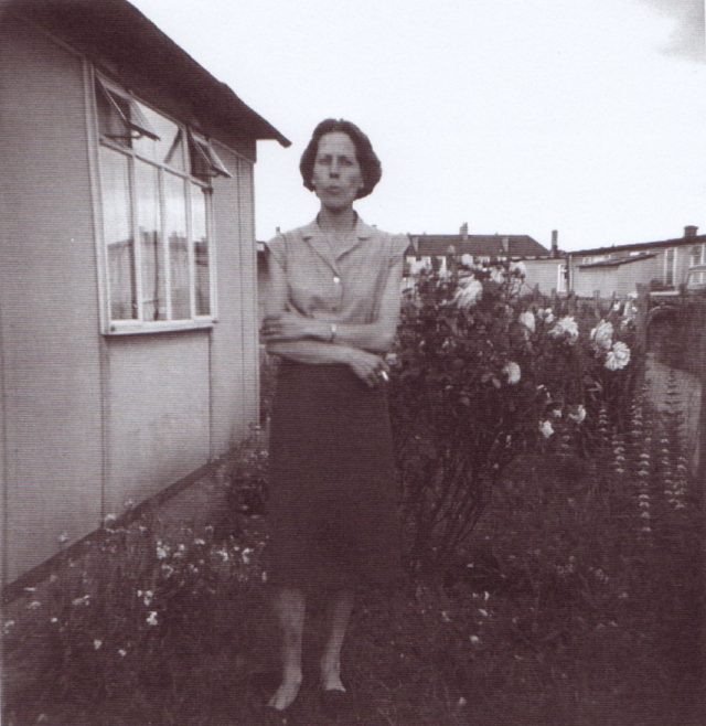 Jim's mum outside the prefab. Excalibur Estate, London SE6