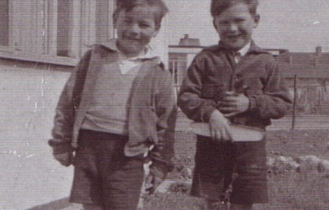 Jim and friend outside the prefab. Excalibur Estate, London SE6