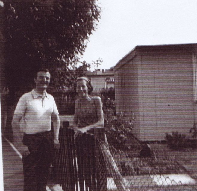 Jim's mum at the prefab gate. Excalibur Estate, London SE6