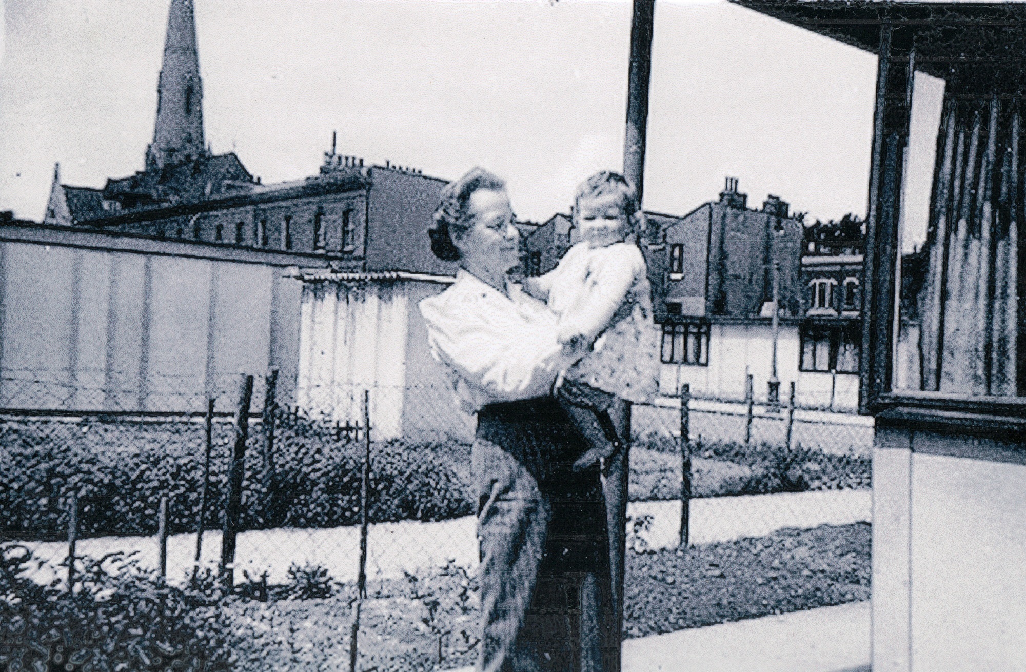 Mrs Rennie with baby. St Lawrence Road, Brixton