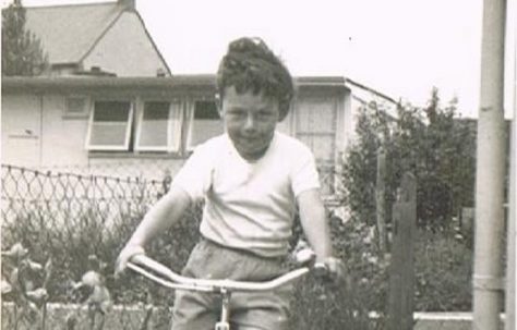 Bernard on his bike in the prefab garden. 60 Harewood Road, Coventry