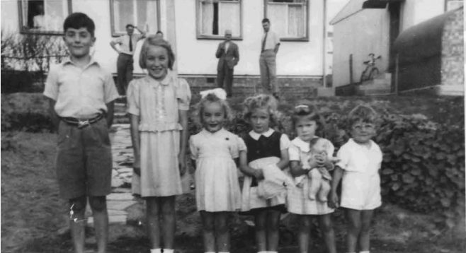 Bob and friends in front of the prefab. Barnfield Road, St Mary Cray