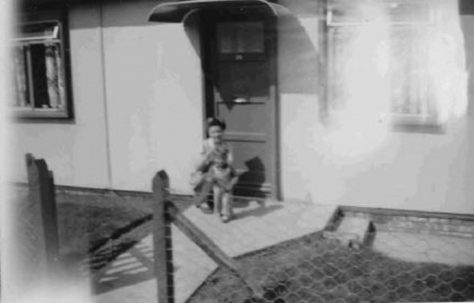 Bob and his mum on the prefab step. Barnfield Road, St Mary Cray