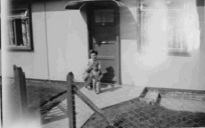 Bob and his mum on the prefab step. Barnfield Road, St Mary Cray