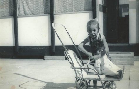 Dave's sister with her doll's pram. Essian Street, Stepney