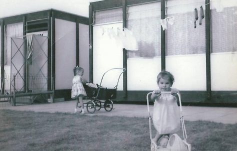 Dave's sisters with their dolls' prams. Essian Street, Stepney