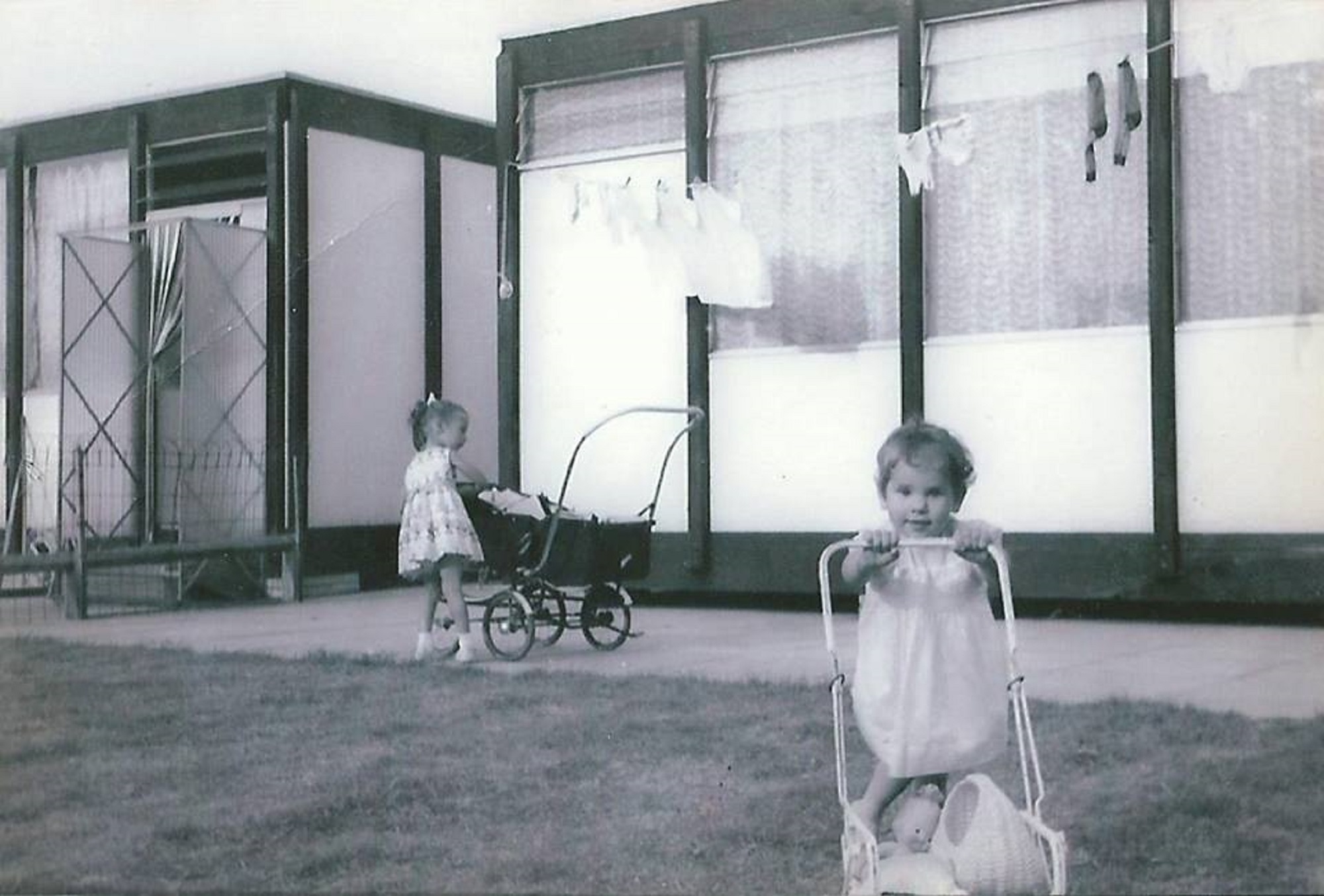 Dave's sisters with their dolls' prams. Essian Street, Stepney