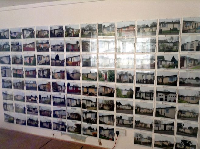 Wall of photos of prefabs on the Excalibur Estate, Prefab Museum. 15 April 2014.