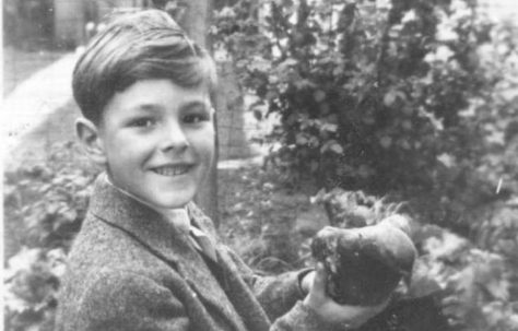 Robert holding a racing pigeon he found and restored to its owner, taken on Coronation day. Kendal Road, London NW10