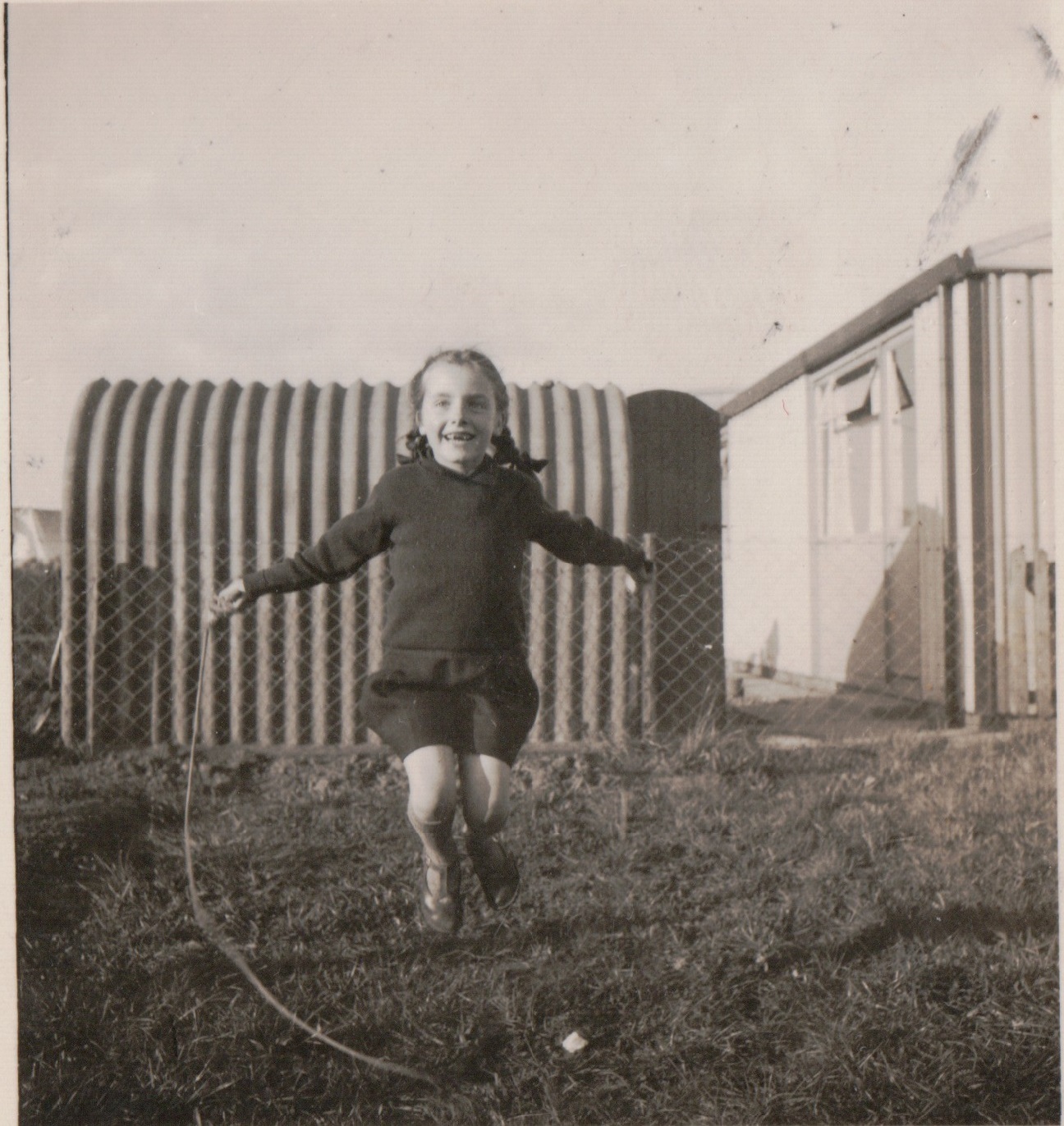 Anne skipping in the prefab back garden, St Andrews Drive, Lincoln