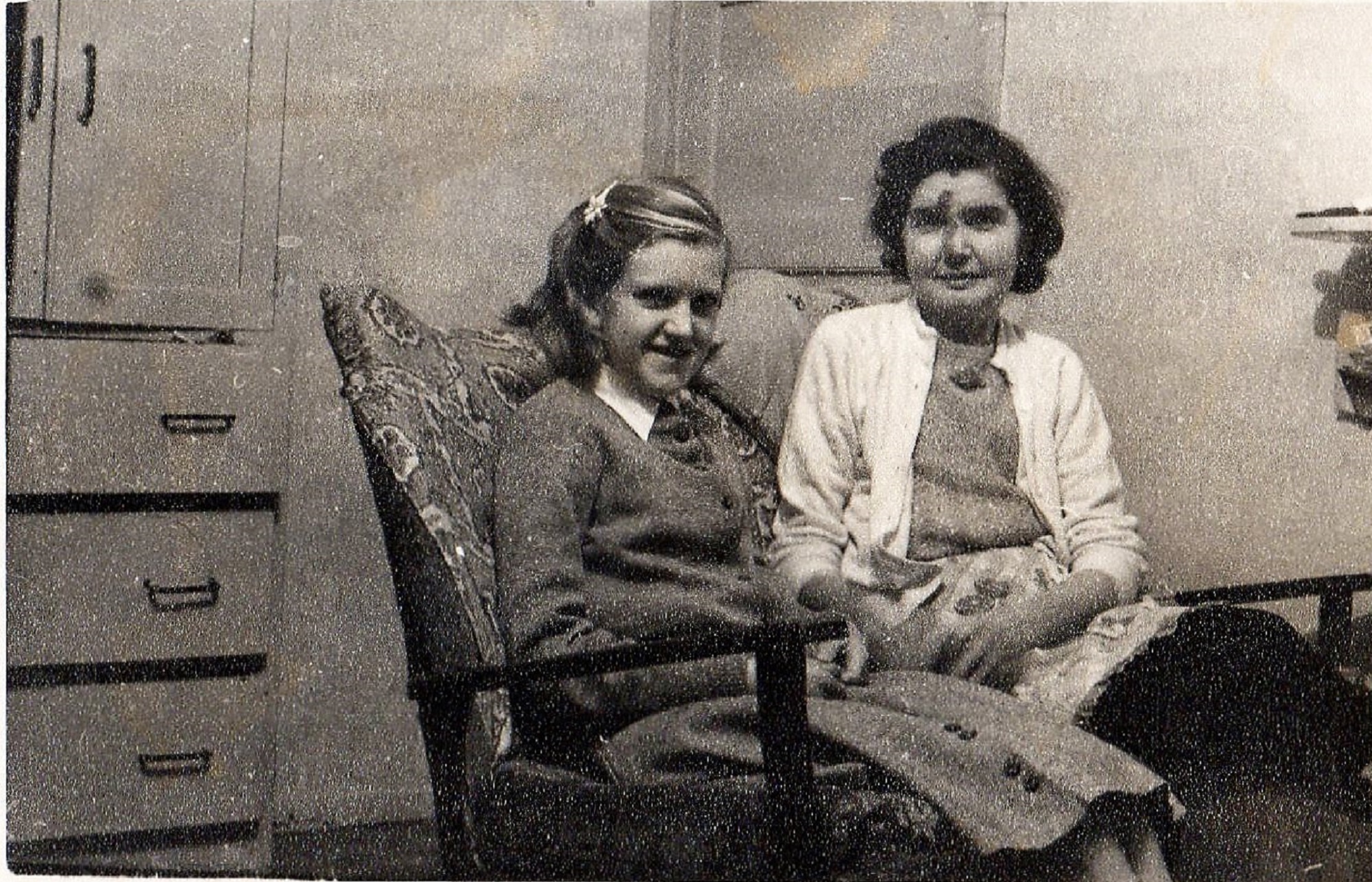 My mother Nellie Attwell & me, Brenda Attwell (now Ward) sitting on our little settee to the left of the fire place with the door into the hall behind us. Port Talbot Place, Fforestfach, Swansea
