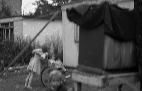 Children playing in the prefab garden. Sixth Street, Pollards Hill