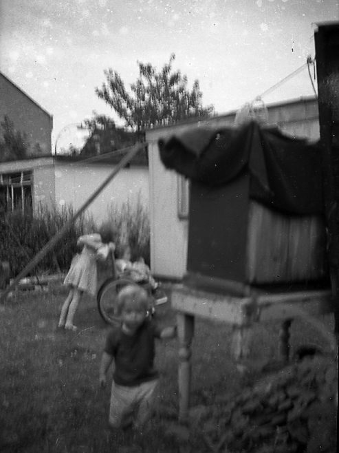 Children playing in the prefab garden. Sixth Street, Pollards Hill