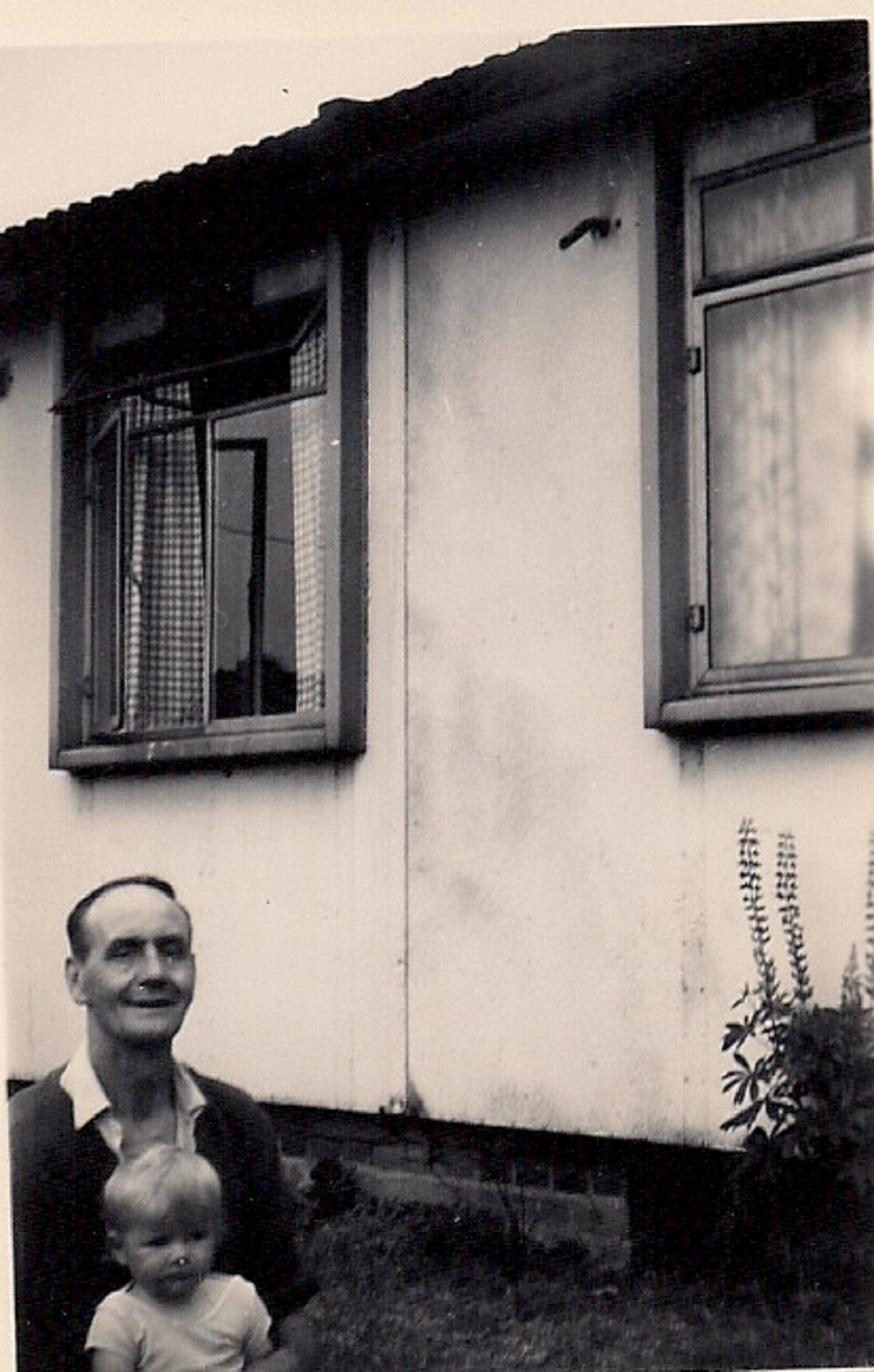 Martyn with his grandfather outside the prefab. Stapleford Road, Kings Norton