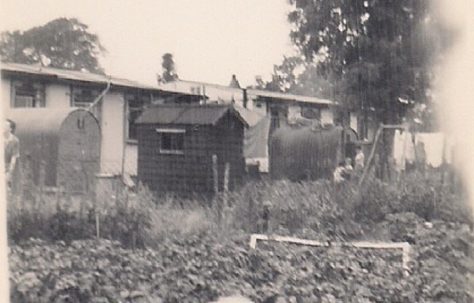 Martyn in his pram in the prefab garden. Stapleford Road, Kings Norton