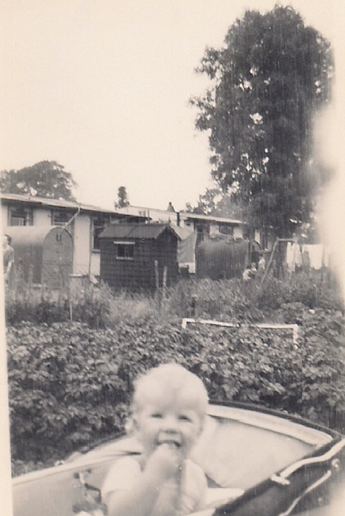 Martyn in his pram in the prefab garden. Stapleford Road, Kings Norton