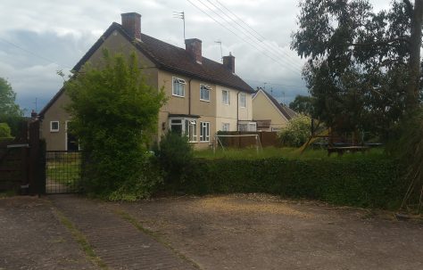 Pair of Swedish houses with dormer bungalow in the background. Oake, Devon