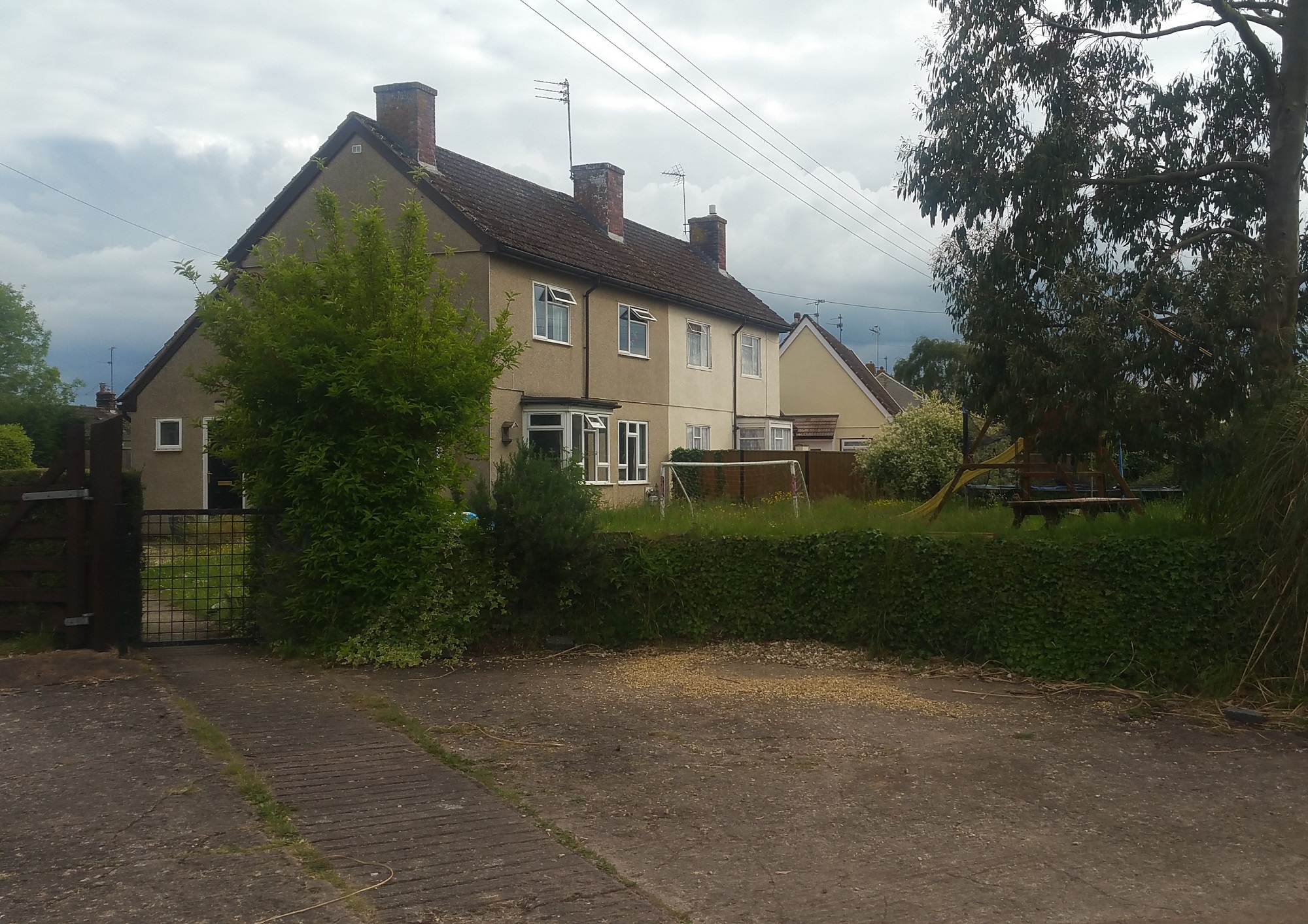 Pair of Swedish houses with dormer bungalow in the background. Oake, Devon