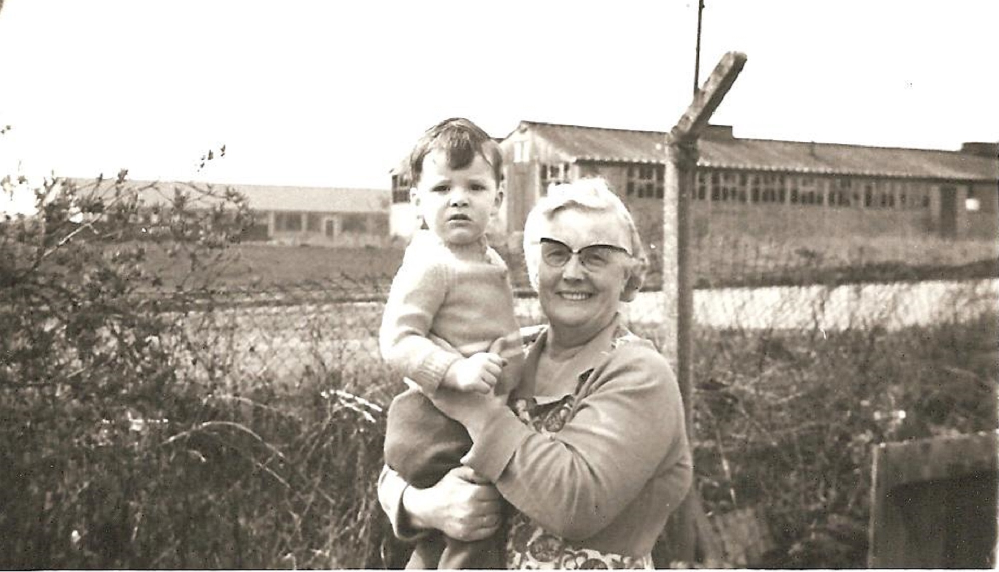 Alan with his grandmother Elizabeth Berriff in the garden of her prefab, Ascot Park, London