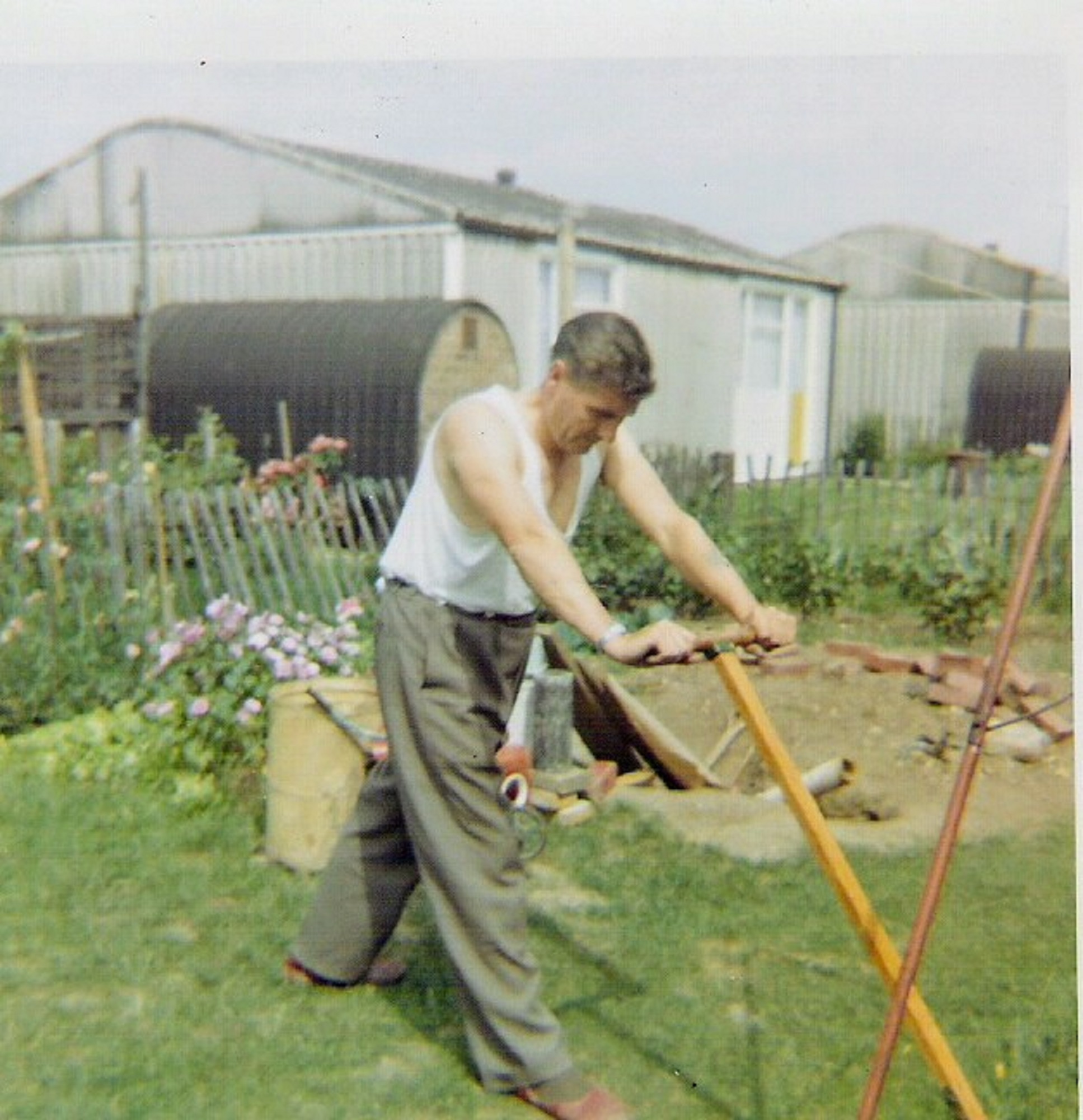 Dad mowing the lawn, 849 Ripple Road
