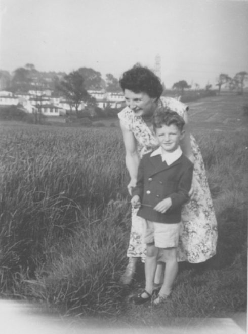 John with his mother Phyllis crossing the wheat field. Dark Lane Estate, 4 Holbrook Avenue, North Wingfield