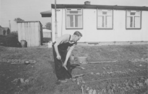 John's father, Ernest Quick, digging the back garden. Dark Lane Estate, 4 Holbrook Avenue, North Wingfield