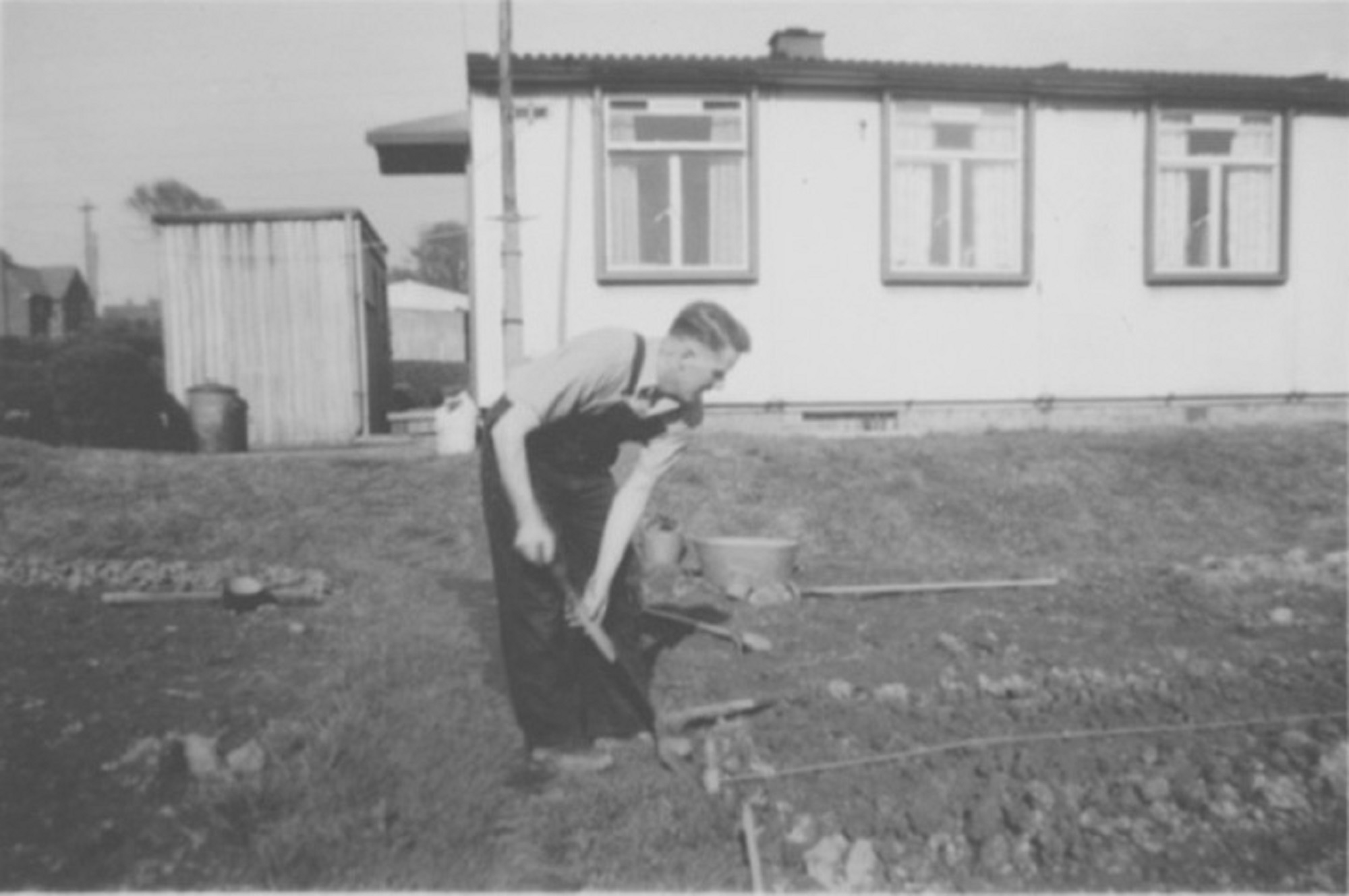 John's father, Ernest Quick, digging the back garden. Dark Lane Estate, 4 Holbrook Avenue, North Wingfield