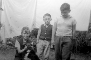 John with Bonzo the dog, Roy Powell and Pat Larkin who also lived in Reaston Street. London SE14