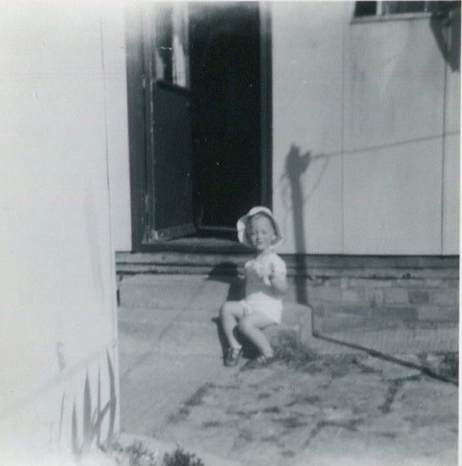 Harry sitting on the prefab steps, Bants Lane, Northampton