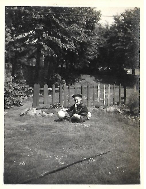 JOHN BUGG AGE 9 IN GARDEN OF 83b CARLETON ROAD. WHOLE GARDEN WAS OURS. 1956