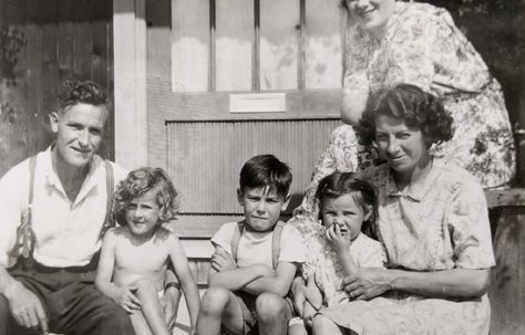 Three kids with Mum and Dad on the front porch. Swallow Street, Iver Heath, Buckinghamshire