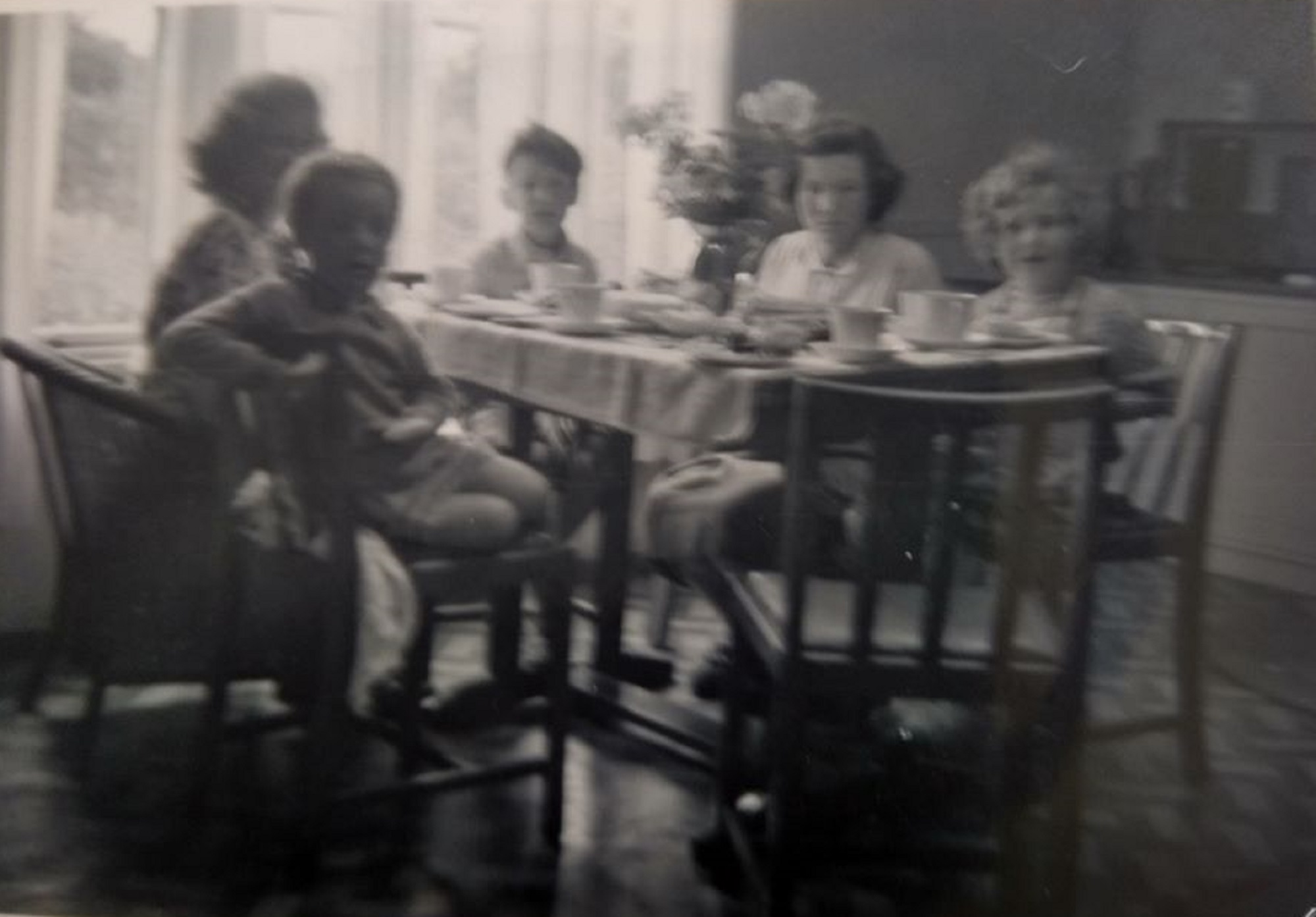 Family around the table. Swallow Street, Iver Heath, Buckinghamshire