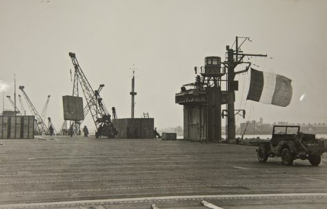 French Aircraft Carrier 'Dixmude' loading prefabs at Newport Docks, probably in 1946.