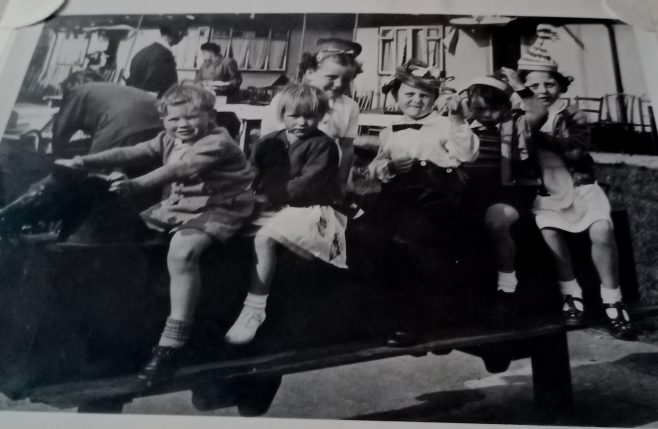 Children on rocking horse. Coronation Street party 1953. My brother Jim second from back. Limbourne Avenue, Dagenham | John Blake