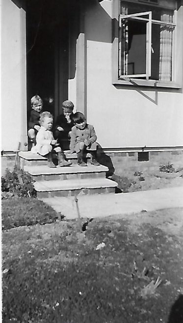 Pat (on the front at the right) and friends on the prefab steps, Douglas Road, Lenham | Pat Jessup