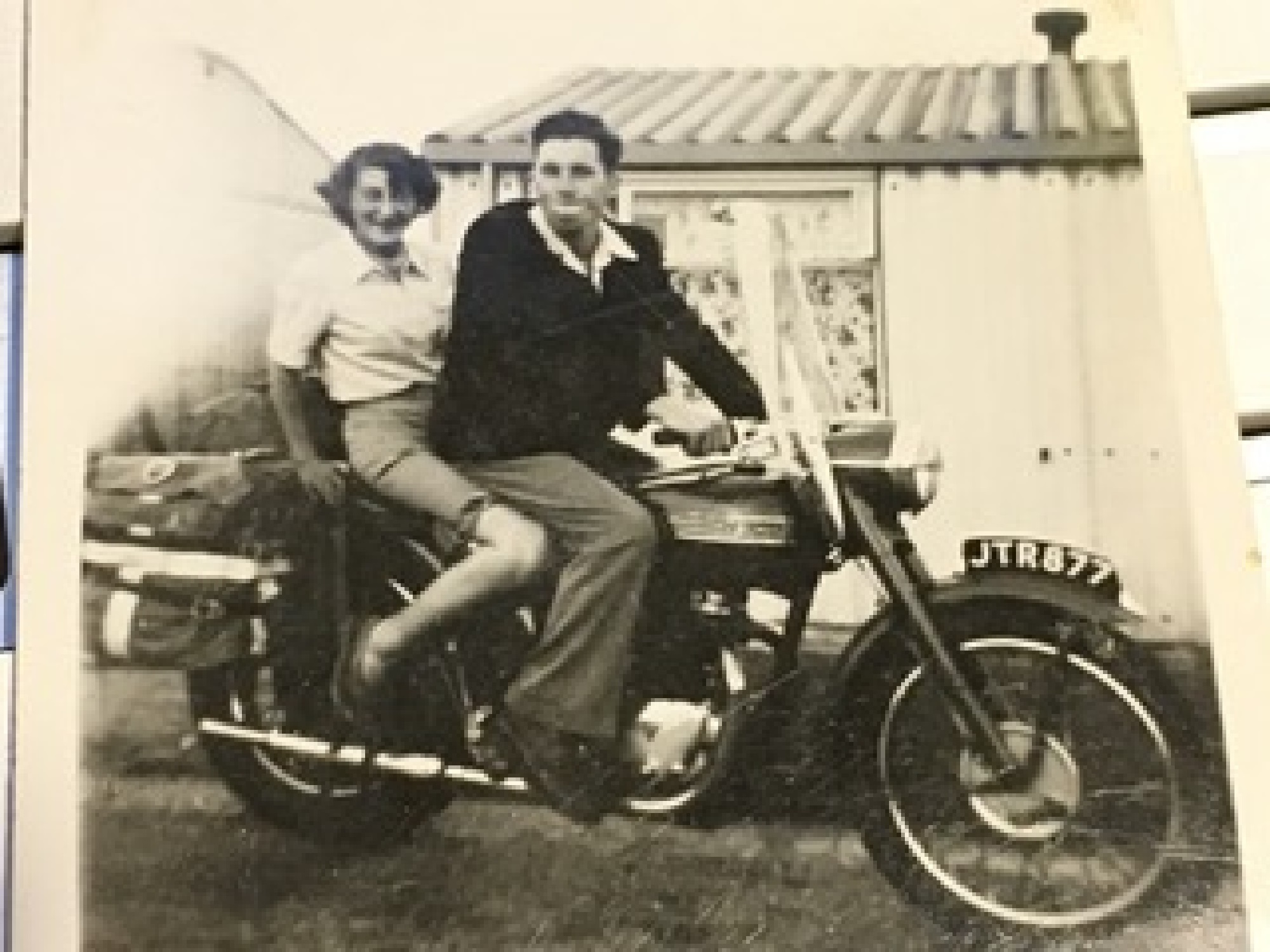 Outside our prefab, Uncle Alan impressing his girlfriend, soon to be wife, Sheila, on his Triumph Bonneville about 1955. 15 Bonchurch Road, Southampton