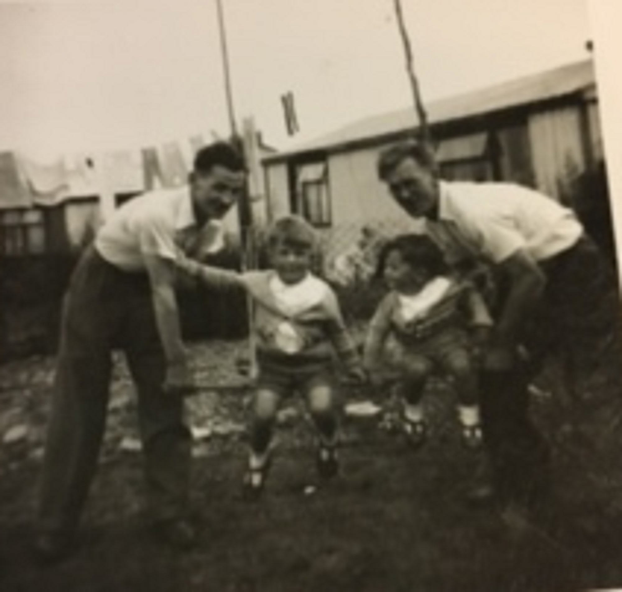 Two limbless ex servicemen who could only live in prefabs enjoy games with the kids 1955. 15 Bonchurch Road, Southampton